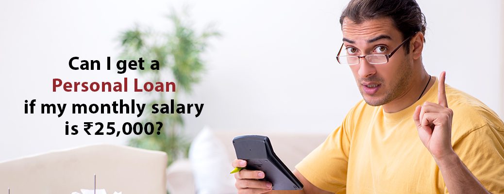 A person with a calculator ponders, "Can I get a Personal Loan if my monthly salary is ₹25,000?" Explore with IndusInd Bank.