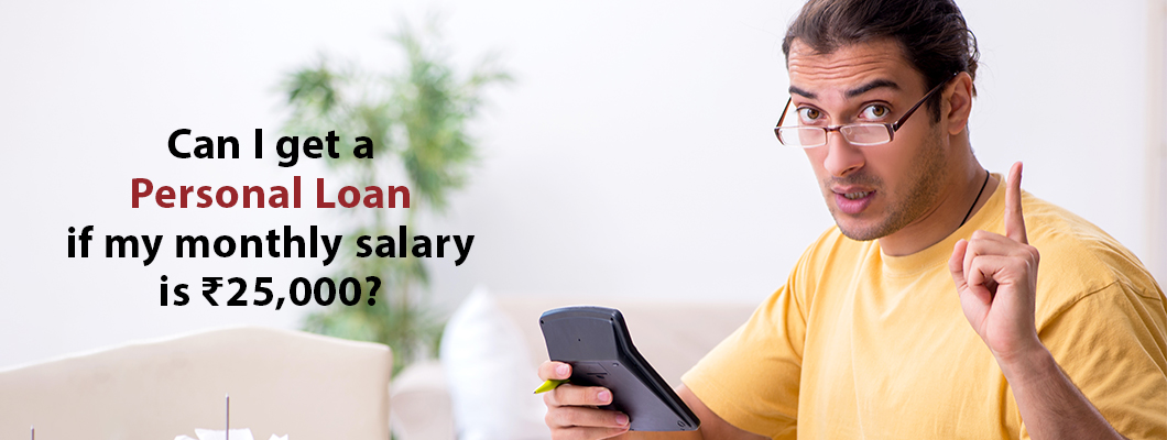 A person with a calculator ponders, "Can I get a Personal Loan if my monthly salary is ₹25,000?" Explore with IndusInd Bank.