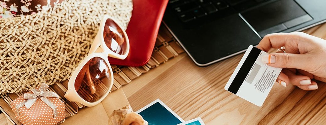 Person travelling smart with IndusInd Bank Credit Card by applying tips for using credit cards.