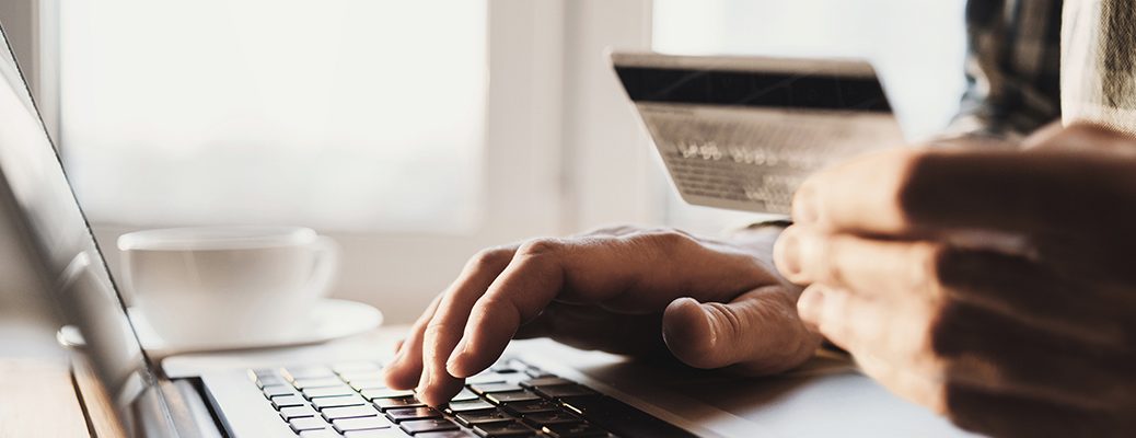 Person activating IndusInd Bank Credit Card on a laptop.
