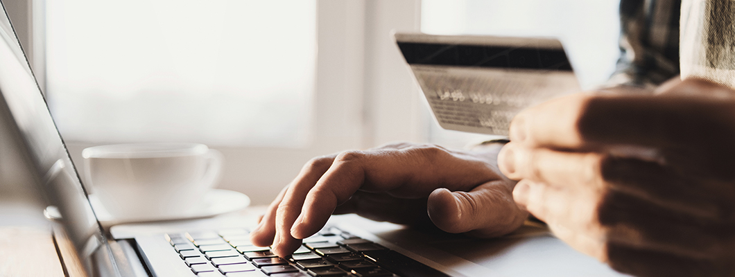 Person activating IndusInd Bank Credit Card on a laptop.