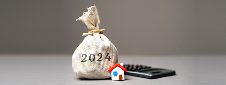 Budget 2024 Highlights: Bag with '2024', house model, and calculator signifying secure future with IndusInd Bank Fixed Deposits.