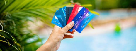 Individual weighing IndusInd Bank credit vs. forex cards for a cost-effective and convenient international trip.