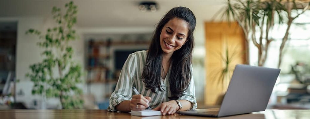 Woman applying for Personal Loan after considering key features offered on Personal Loan by IndusInd Bank.