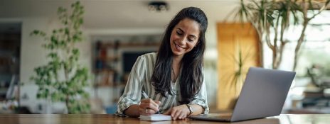Woman applying for Personal Loan after considering key features offered on Personal Loan by IndusInd Bank.