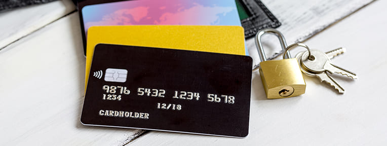 IndusInd Bank credit cards with a padlock and keys symbolizing unblocking credit card effectively.